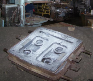 A casting being made using the green sand casting process